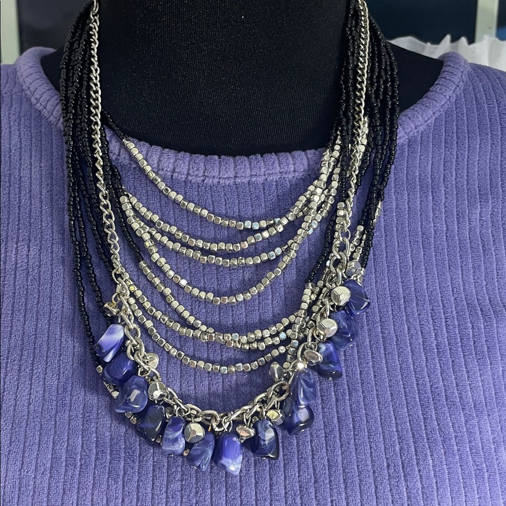 Charming Charlie black and silver multi layered pc paired w/ a purple beaded pc